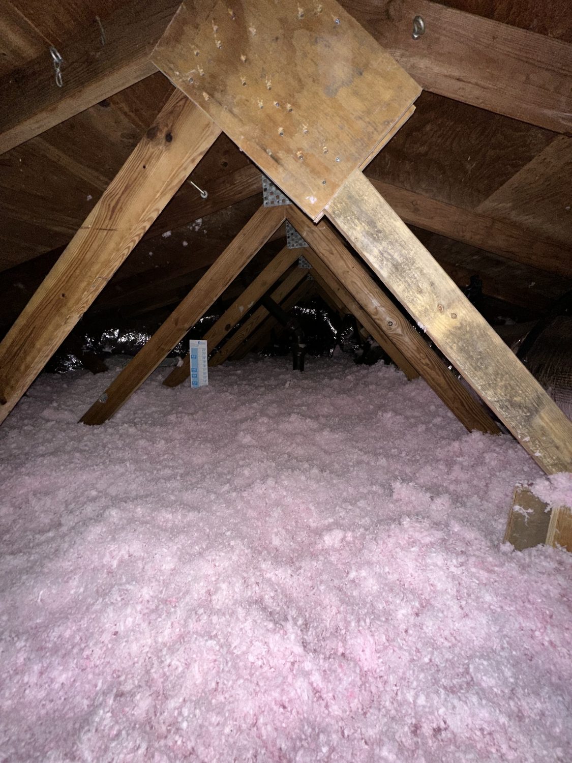 Blown-in fiberglass attic insulation in a Florida home